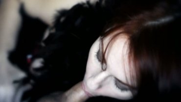 Black feathers frame a seductive blowjob Art of blowjob